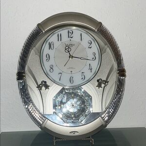 Rhythm "Amazing Carina" musical motion wall clock